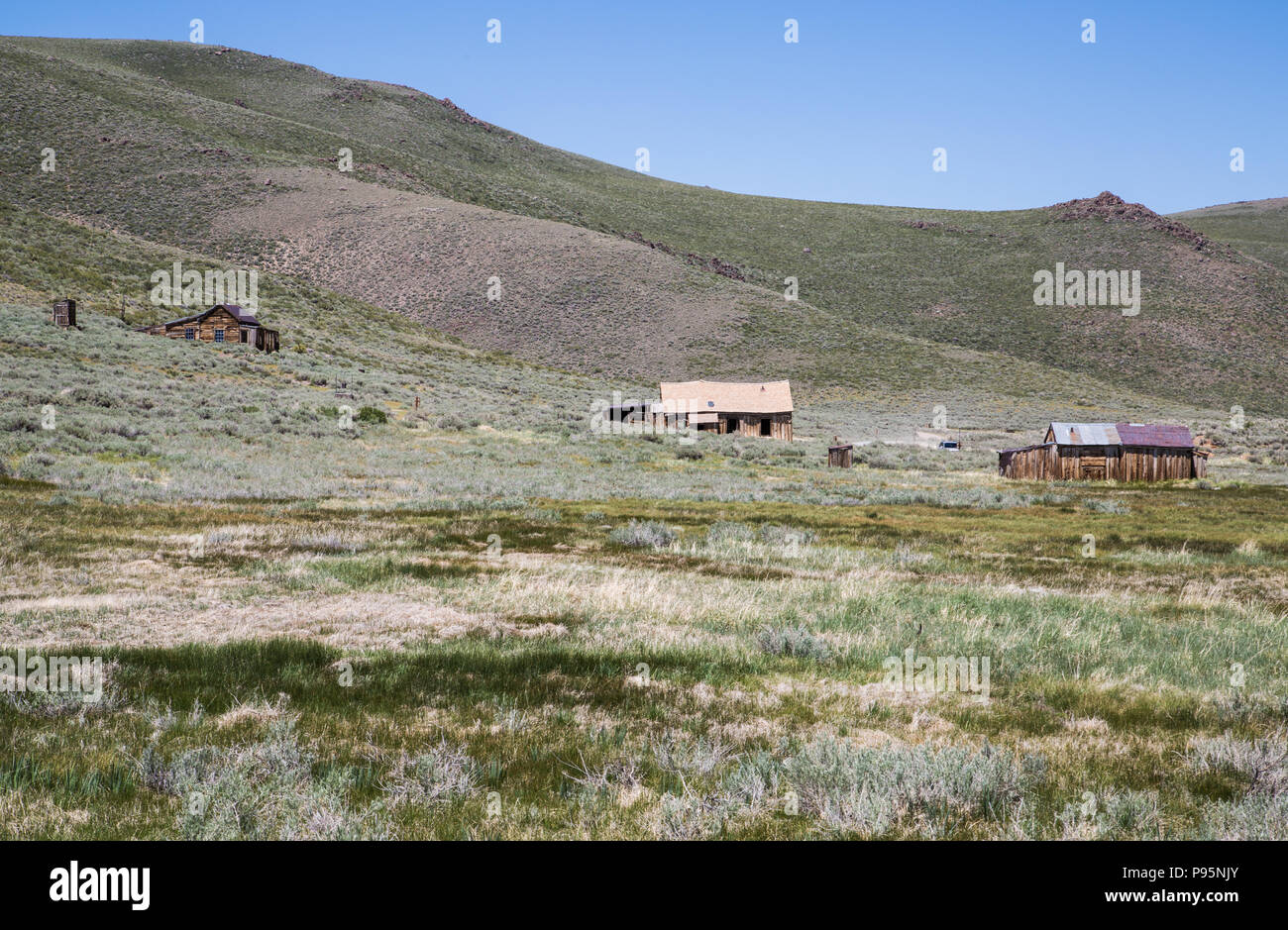 Abandoned homes in the distance in the ghost town of Bodie, California, a mining town from the Old West. Stock Photo