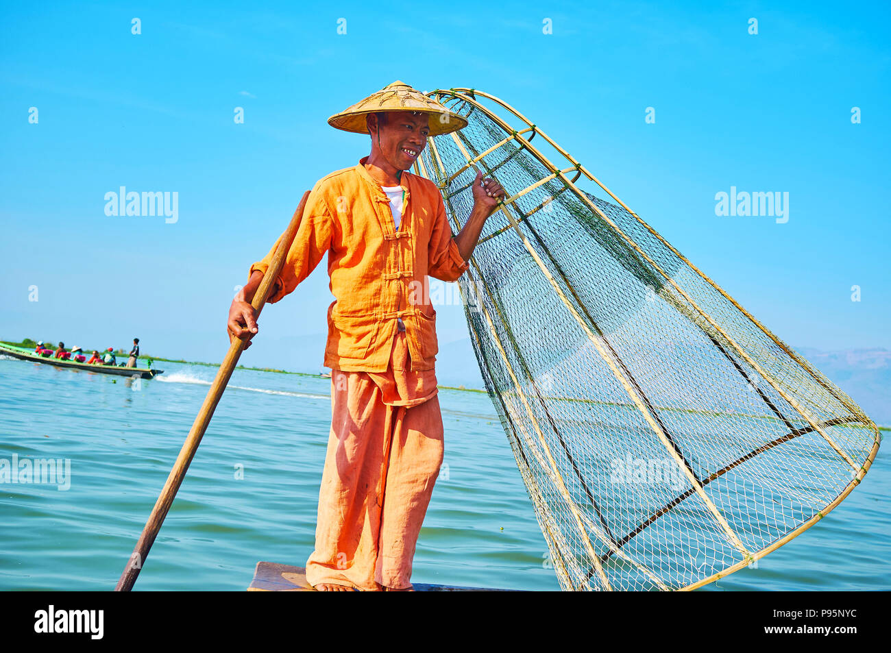 Fisherman pose hi-res stock photography and images - Alamy