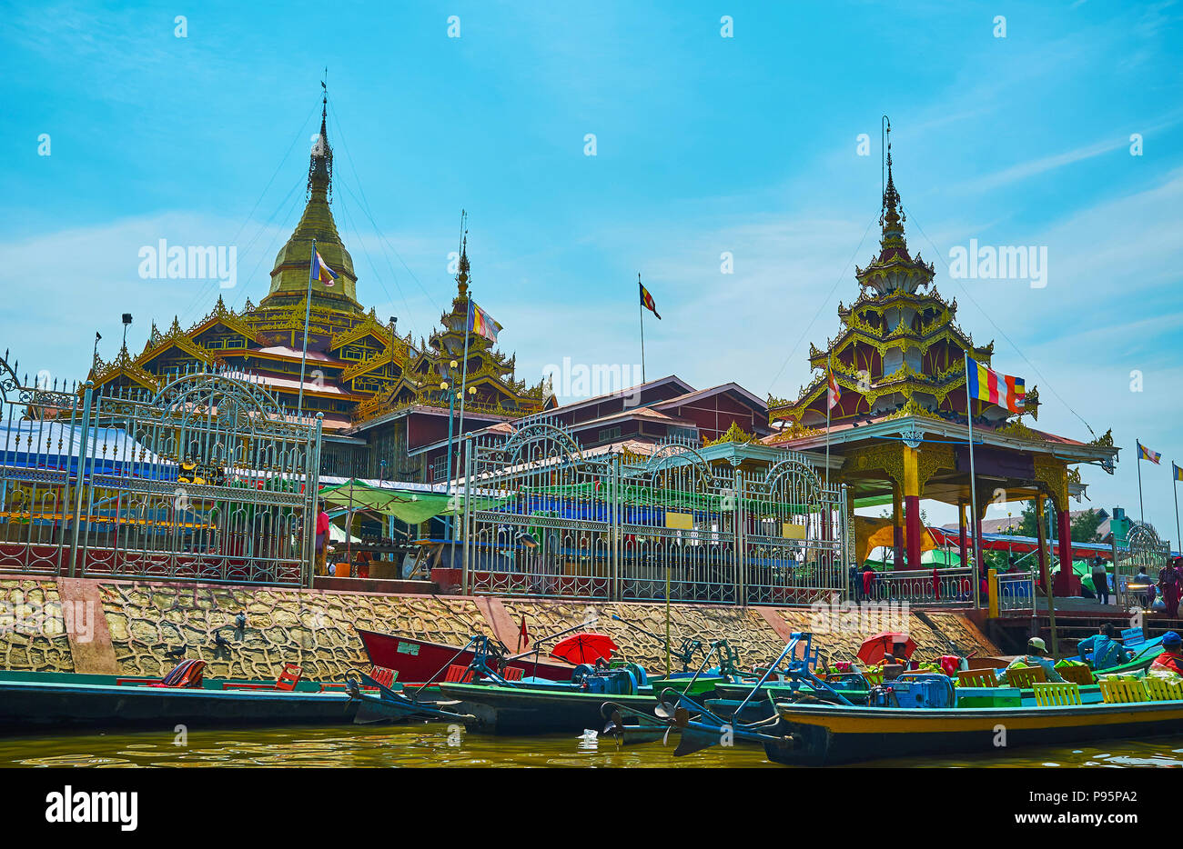 YWAMA, MYANMAR - FEBRUARY 18, 2018: Floating along the wharf of Hpaung Daw U Pagoda - the Buddhist Temple and notable religious historic landmark, on  Stock Photo