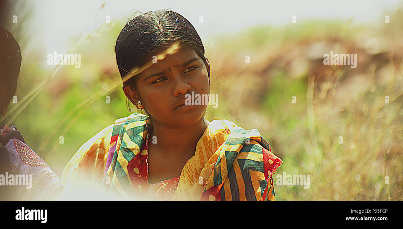 Young girl sitting at a paddy field in the countryside Stock Photo - Alamy