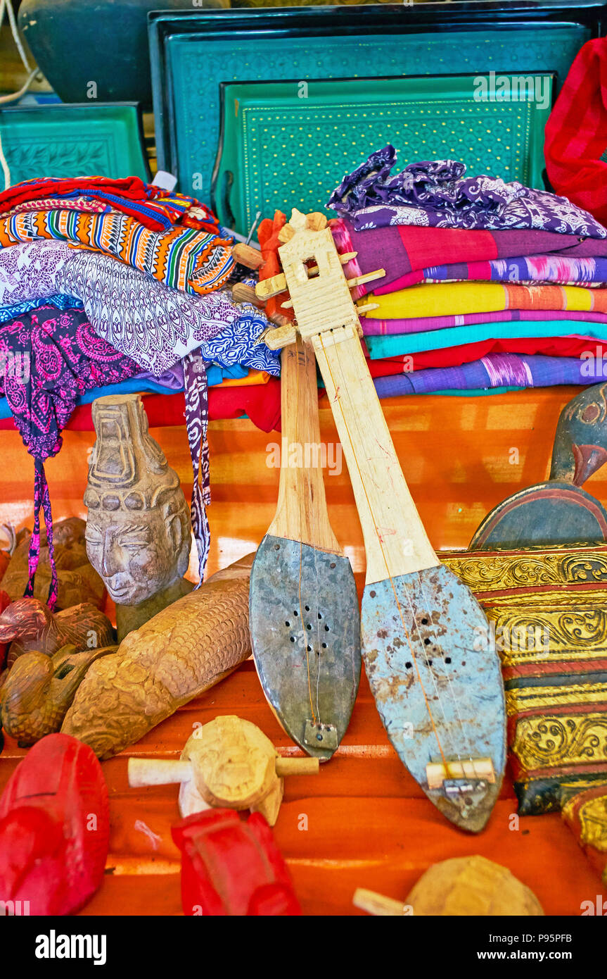 The tourist market of Inn Thein (Indein) village boasts different  souvenirs, such as authentic musical instruments, hand made carved  sculptures, woven Stock Photo - Alamy