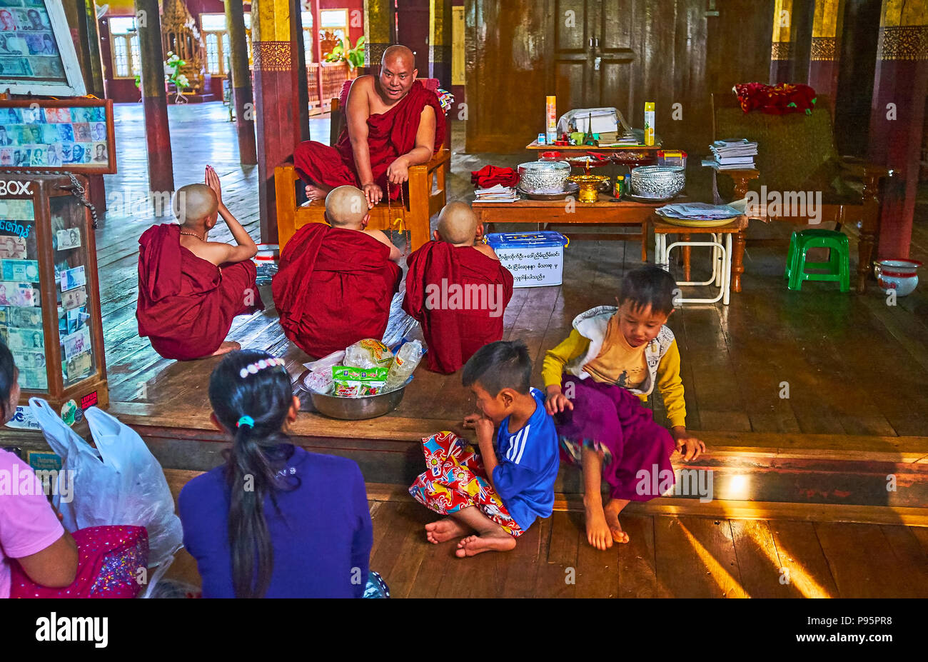 YWAMA, MYANMAR - FEBRUARY 18, 2018: The Bhikkhu monk preaches in Nga Phe Chaung Monastery of jumping cats, on February 18 in Ywama. Stock Photo