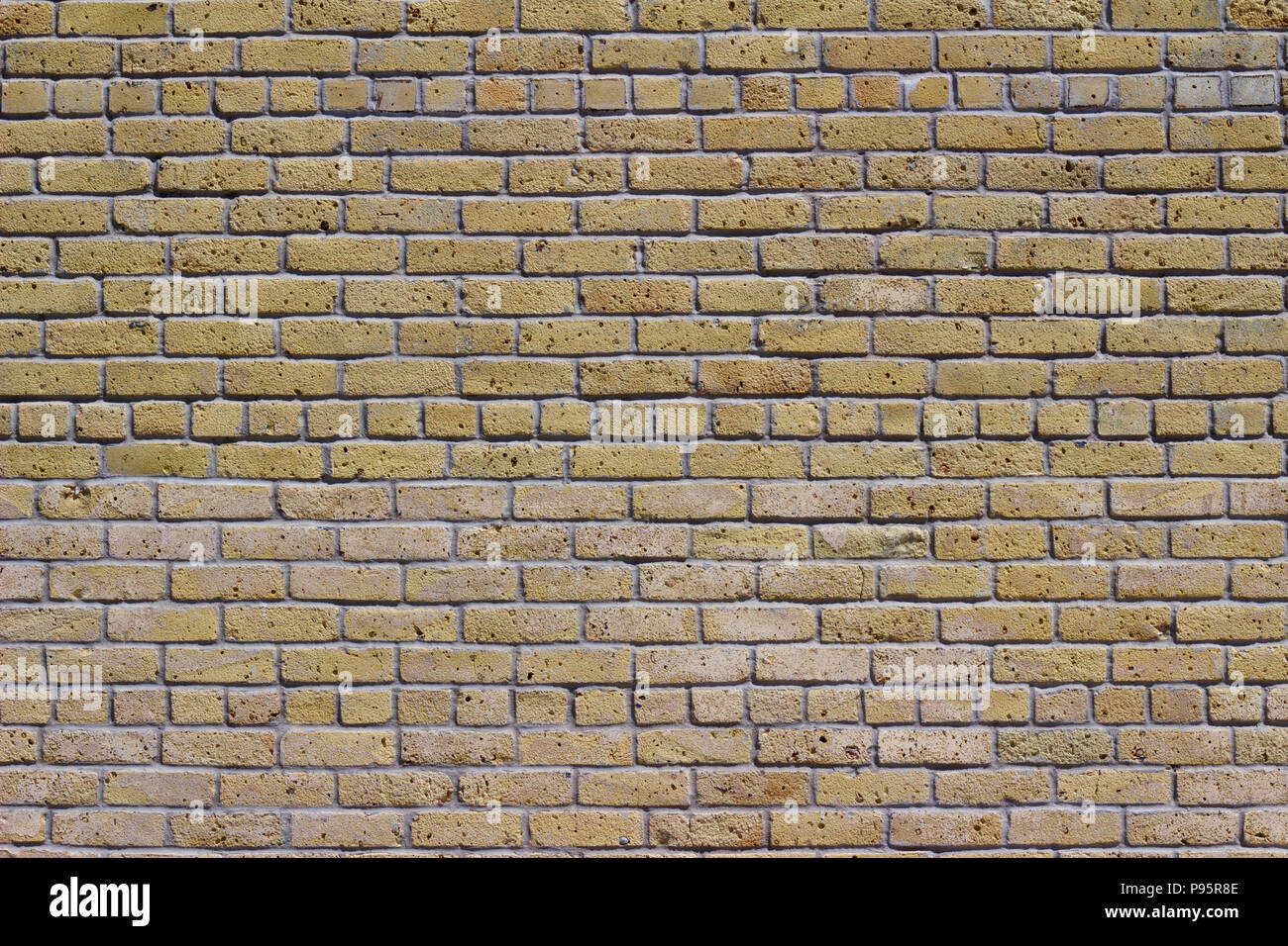 Rustic old white beige brick wall background in common bond pattern with grunge look Stock Photo