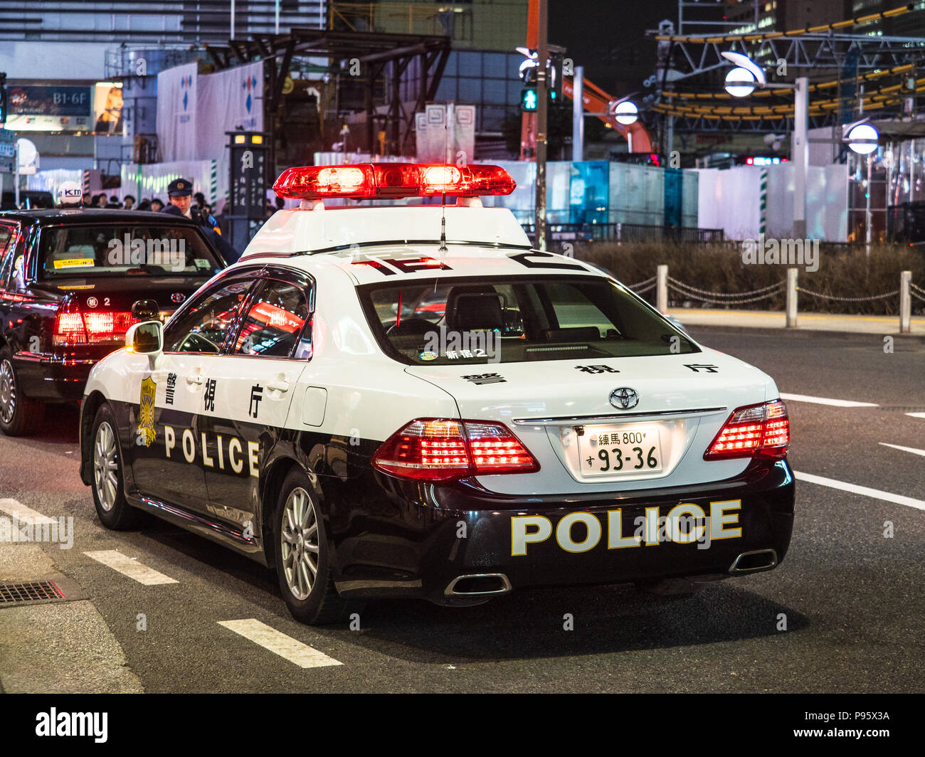 Tokyo Police Car pulls over a Tokyo Taxi. Tokyo Police Patrol Car. Tokyo Police Stop. Stock Photo