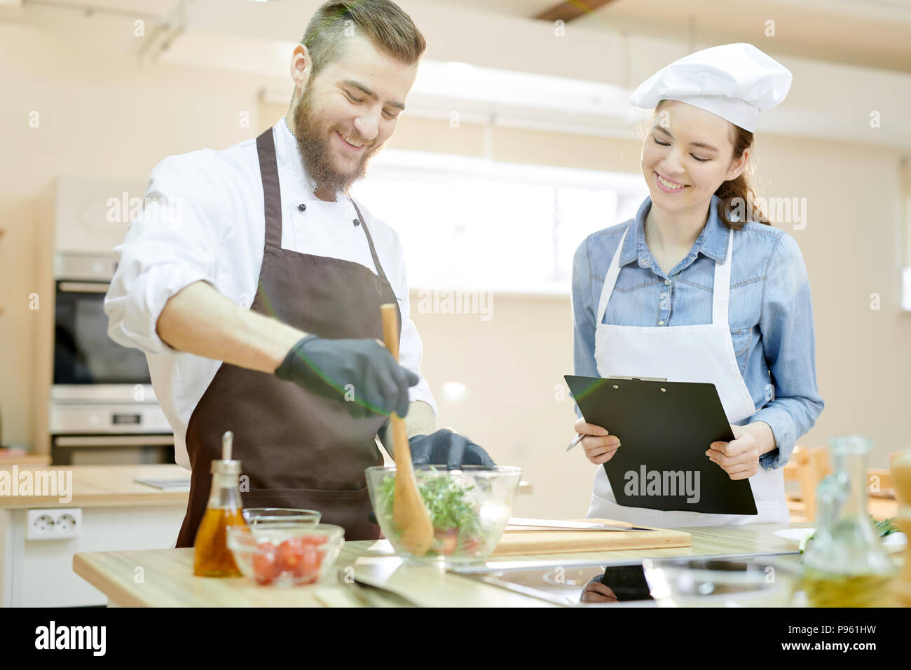 Smiling Chef Working in Restaurant Stock Photo
