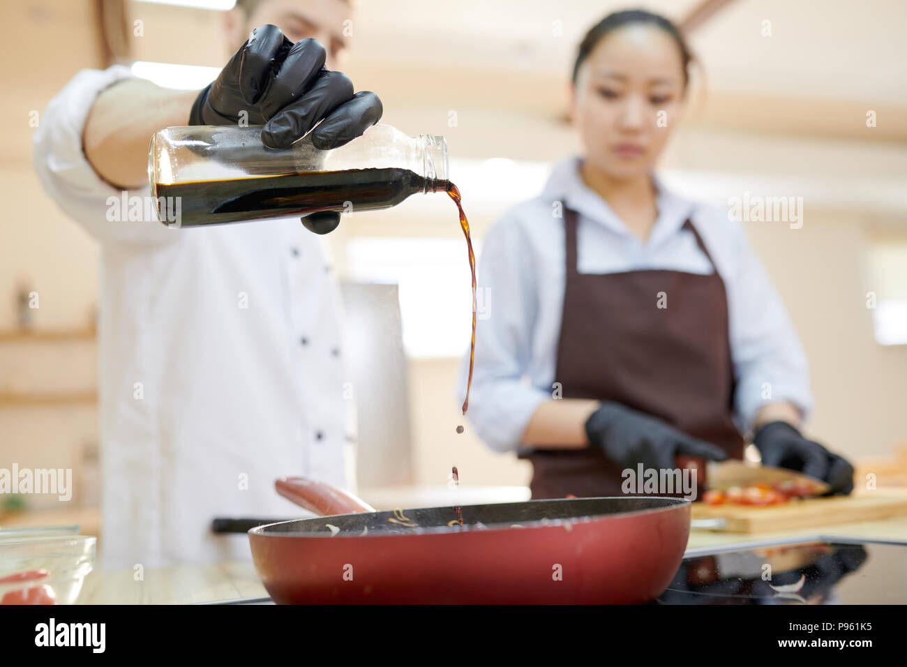 Chef Pouring Soy Sauce Stock Photo Alamy