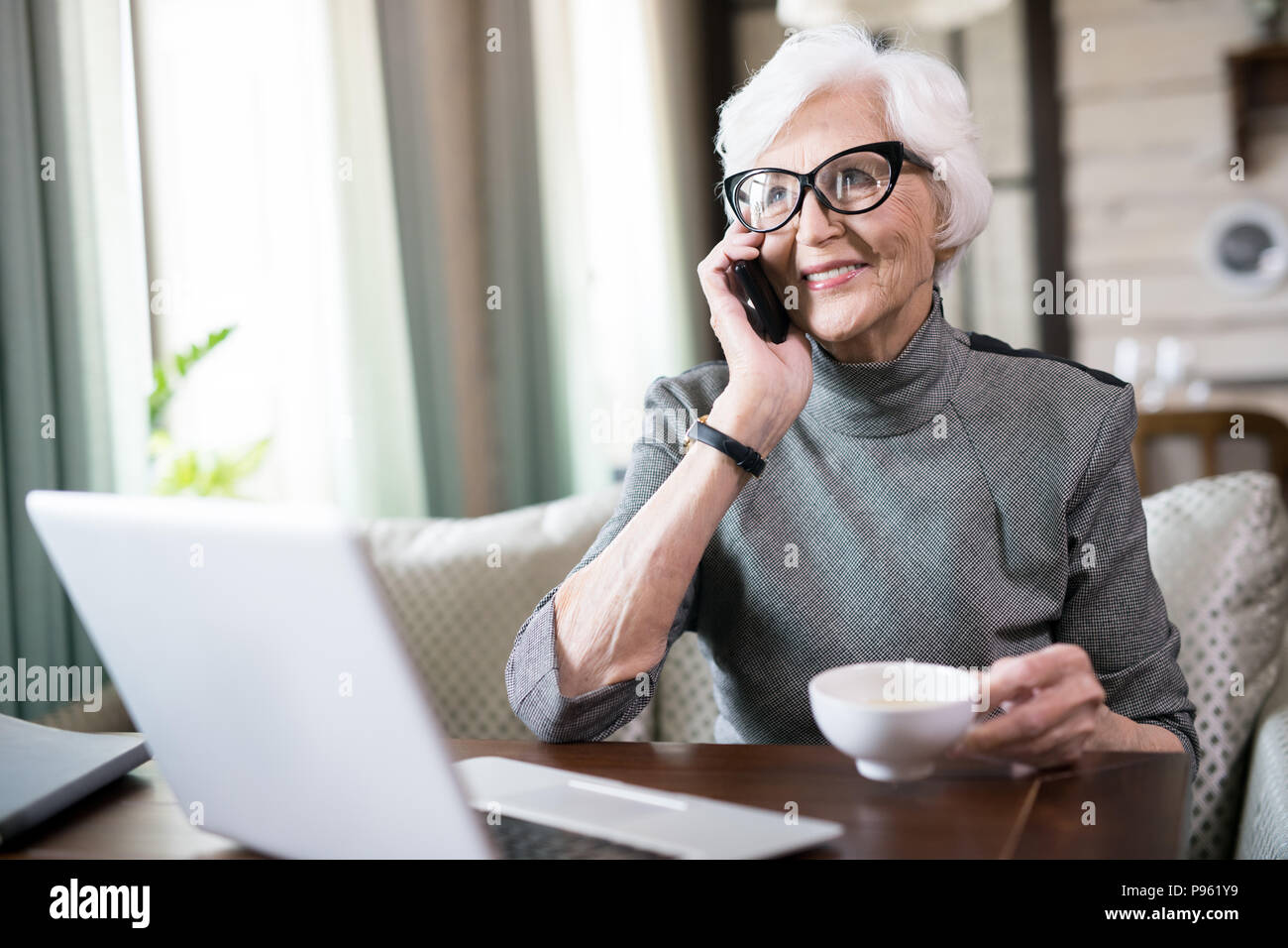 Senior woman talking on phone Stock Photo - Alamy