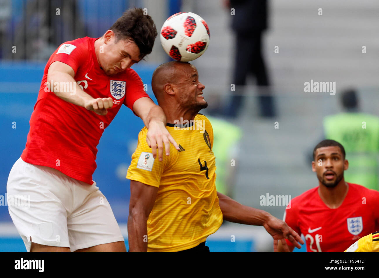 SAINT PETERSBURG, RUSSIA - JULY 14: Vincent Kompany (C) of Belgium and Harry Maguire (L) of England vie for a header during the 2018 FIFA World Cup Russia 3rd Place Playoff match between Belgium and England at Saint Petersburg Stadium on July 14, 2018 in Saint Petersburg, Russia. (MB Media) Stock Photo