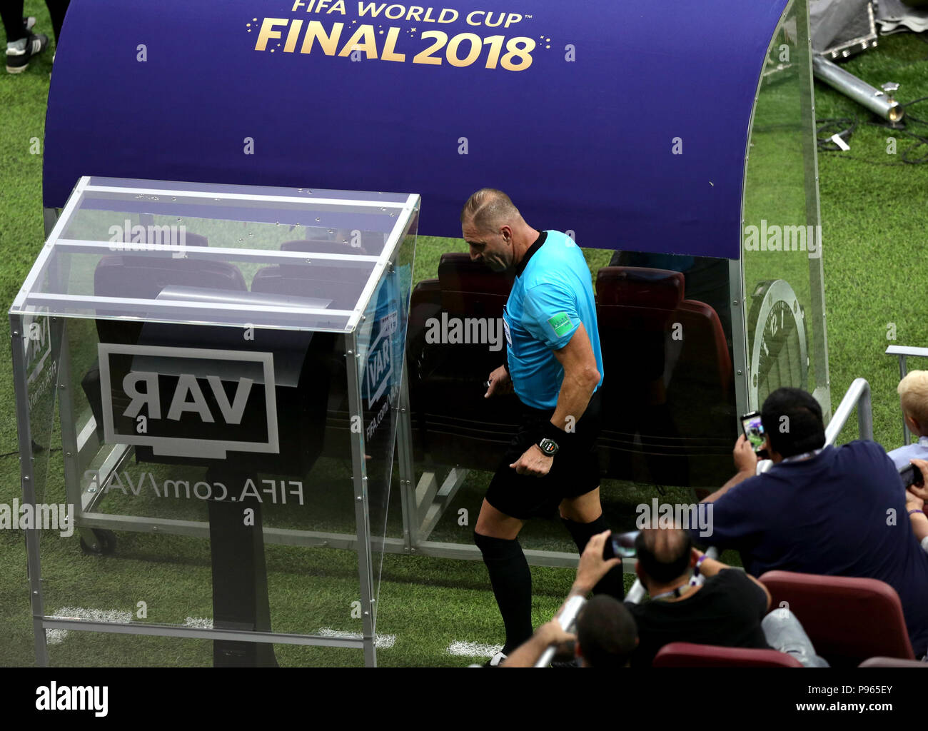 Match referee Nestor Pitana checks the VAR System during the FIFA World Cup Final at the Luzhniki Stadium, Moscow. Stock Photo