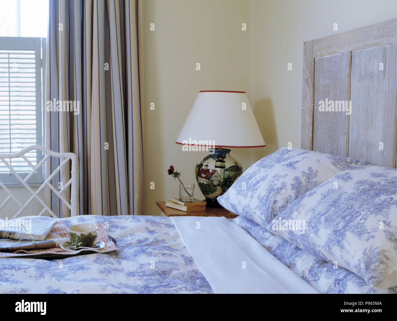 Blue White Toile De Jouy Pillows And Quilt On Limed Wood Bed