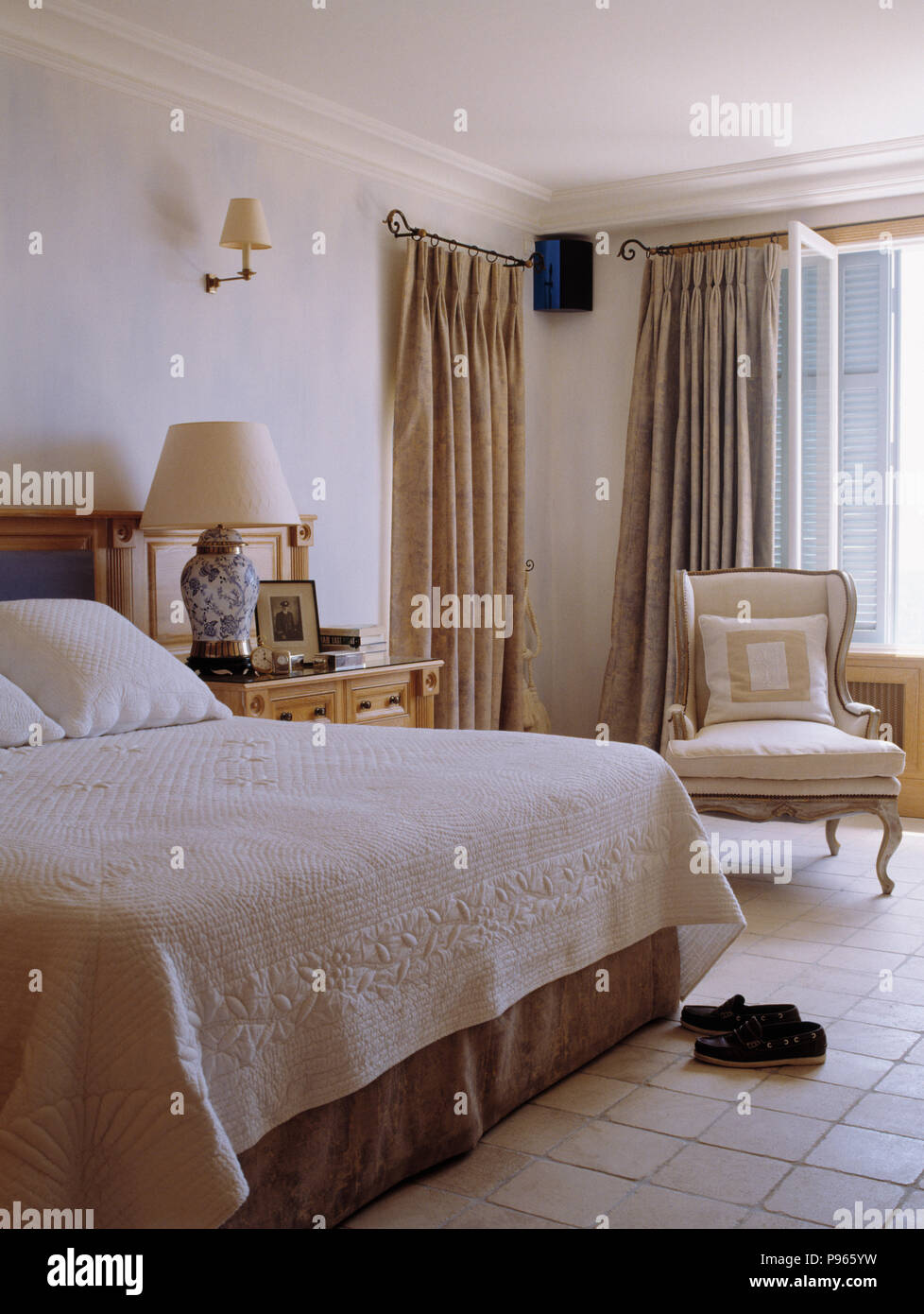 Cream Quilt On Bed In French Coastal Bedroom With Cream