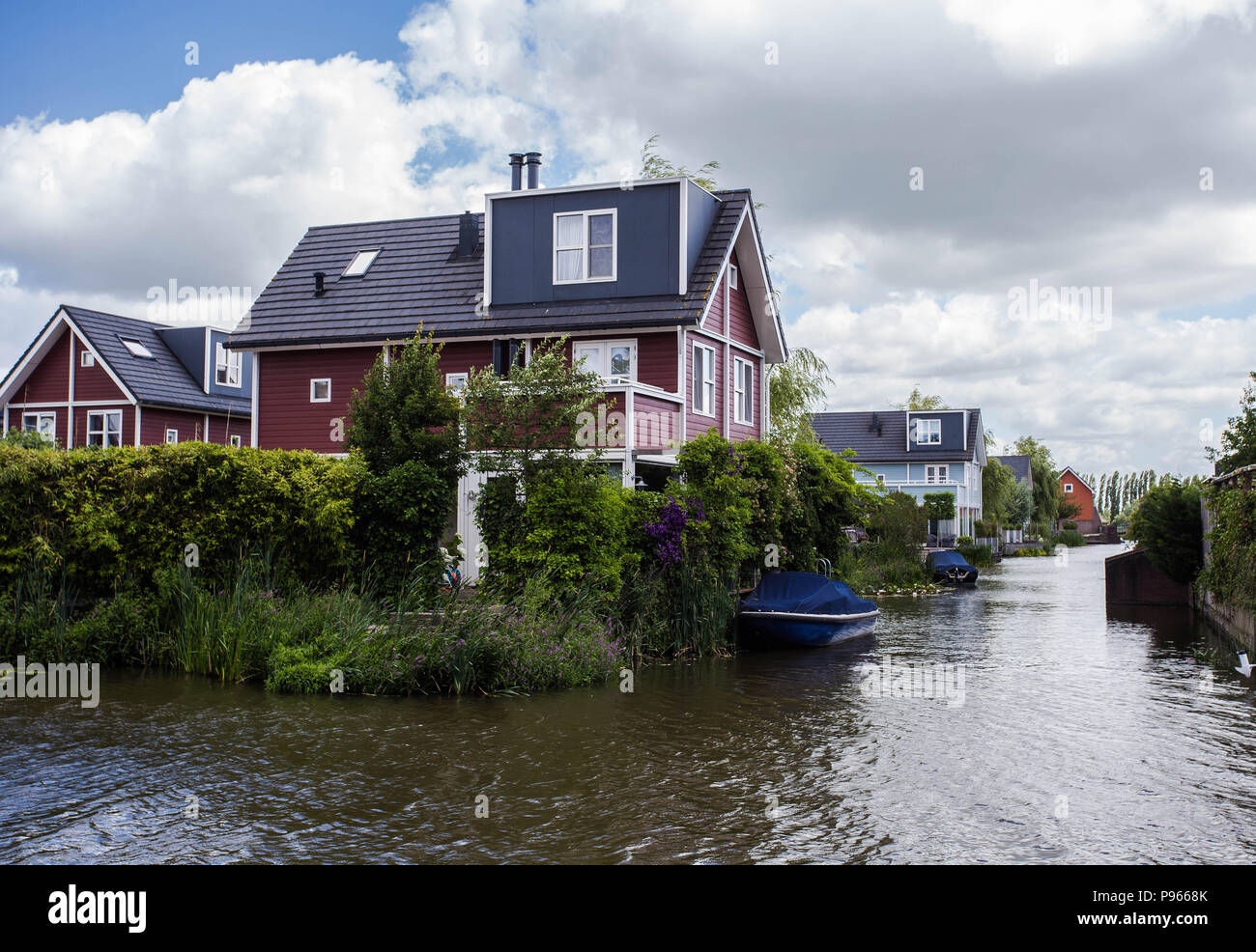 Photo of beautiful modern wooden house by the river Stock Photo - Alamy