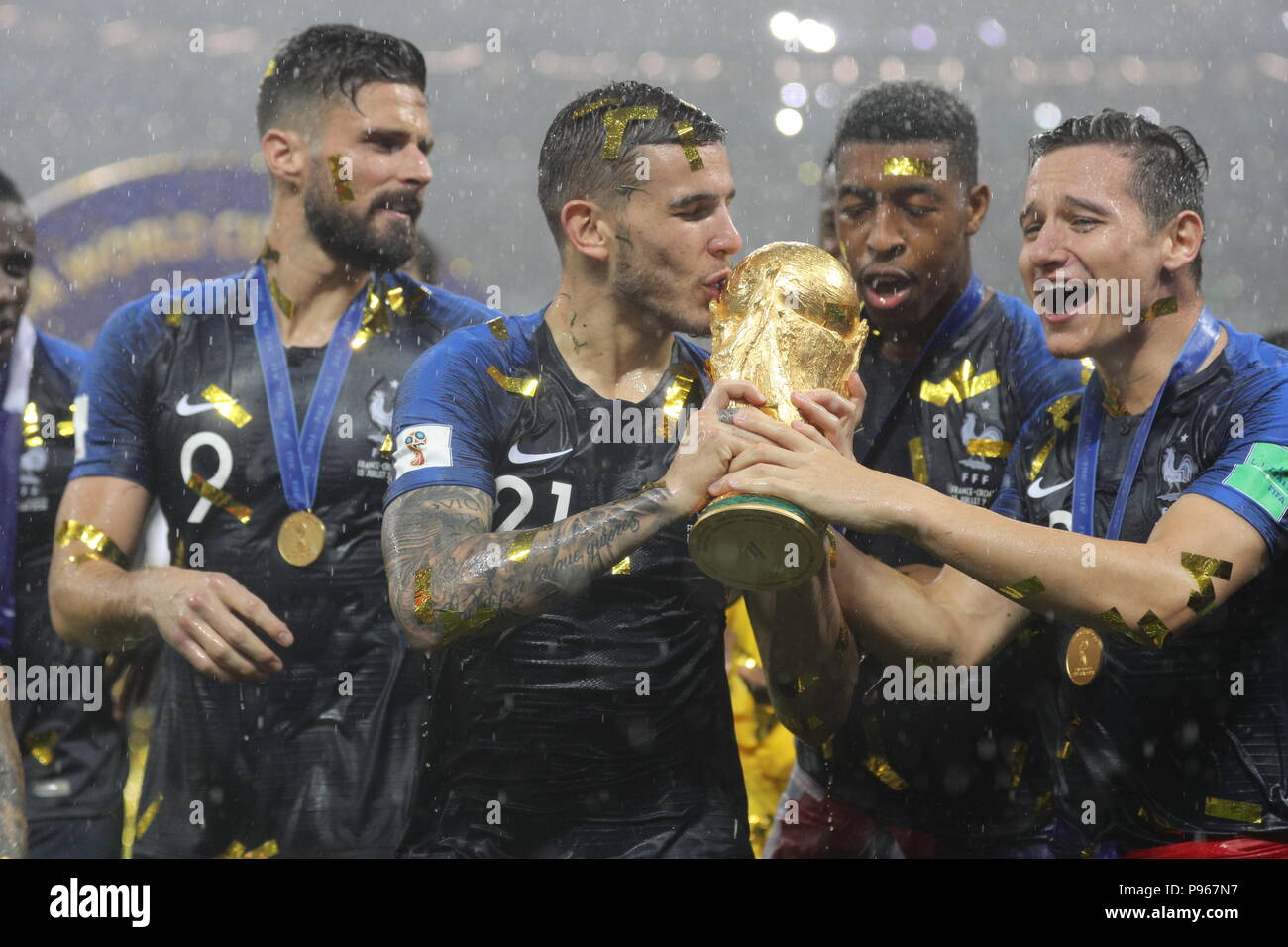 France's (left-right) Olivier Giroud, Lucas Hernandez, Thomas Lemar and Presnel Kimpembe and Florian Thauvin trophy as they celebrate winning the FIFA World Cup Final at the Luzhniki Stadium, Moscow. Stock Photo
