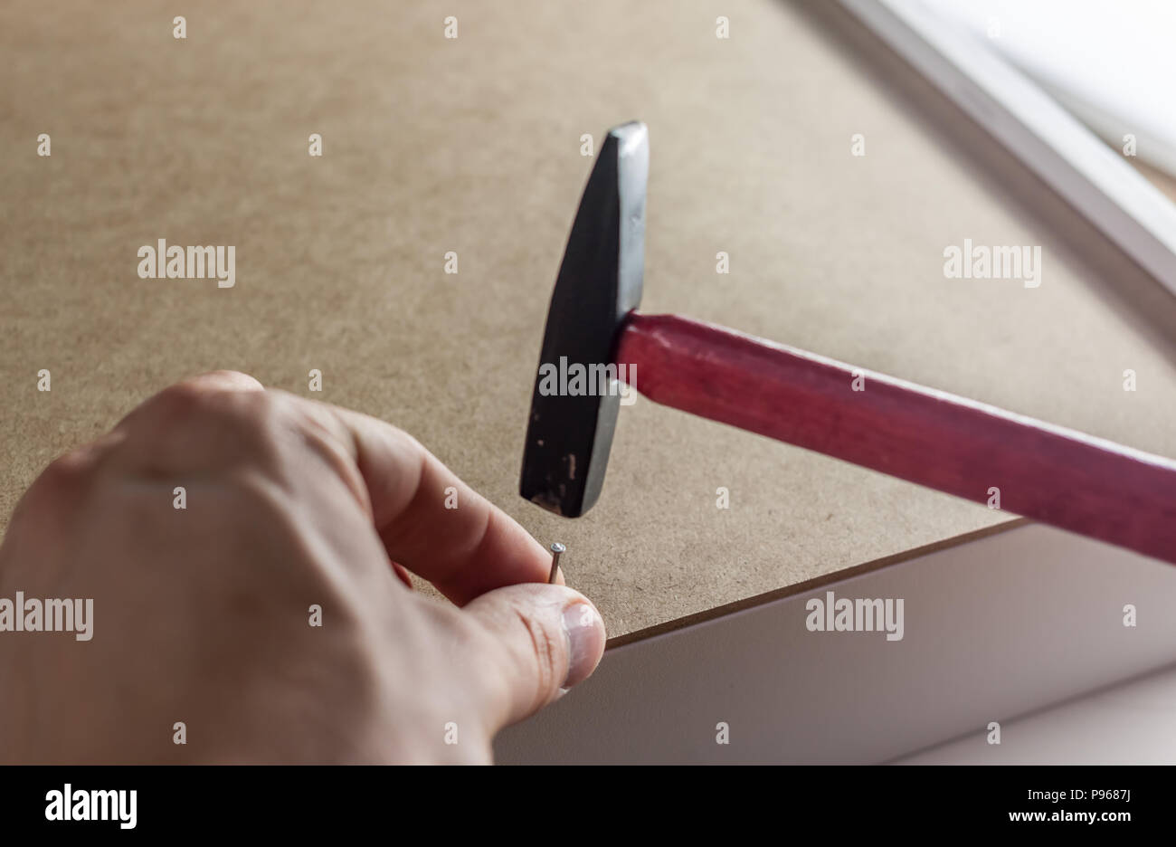 close up hammering a nail Stock Photo