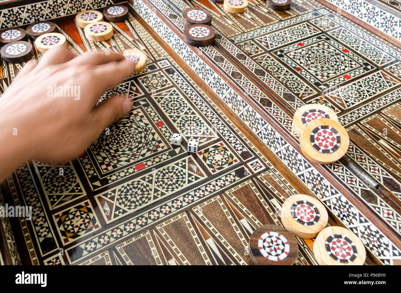 Checkers and dices on backgammon board game Stock Photo