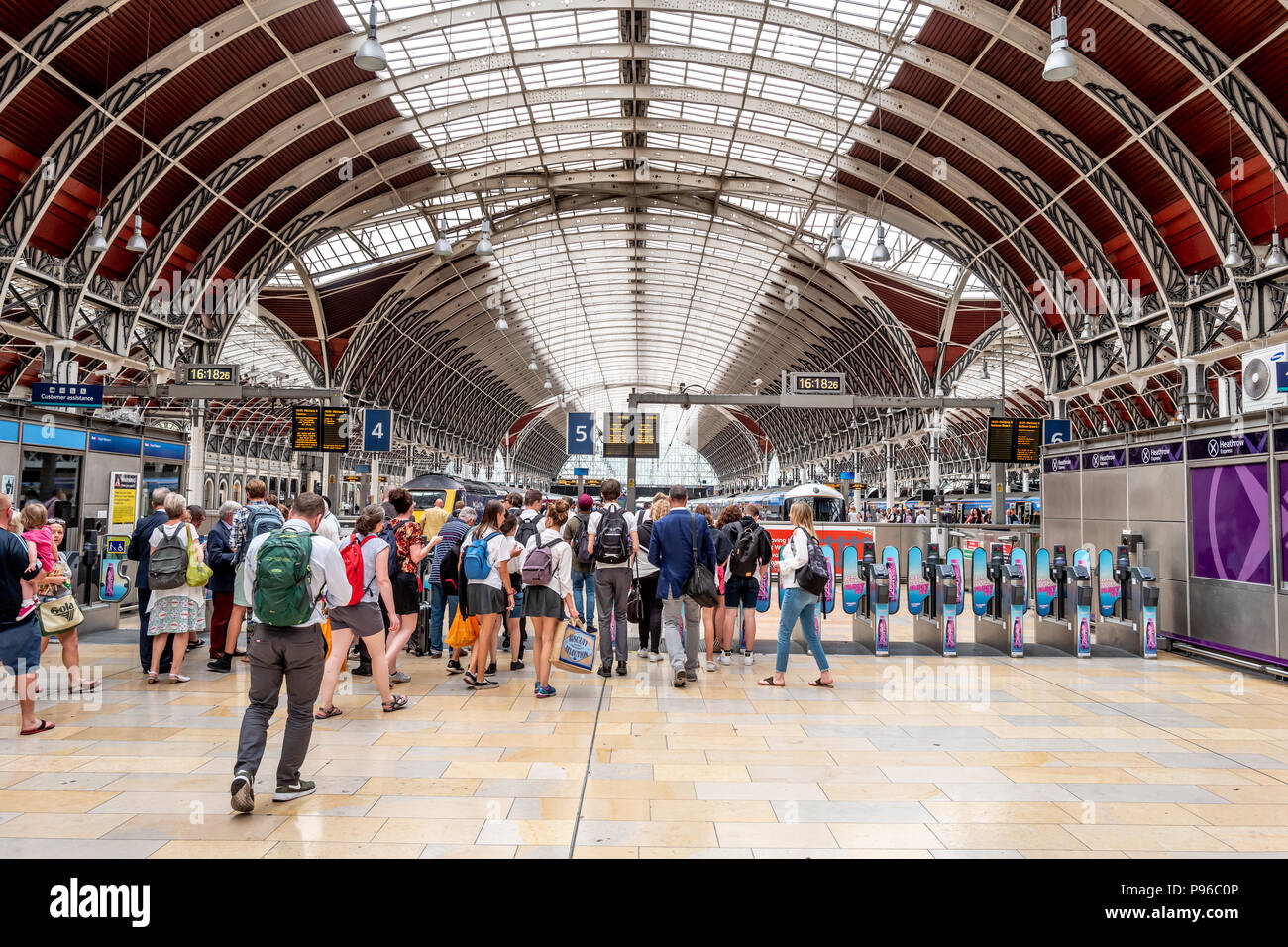 Passengers passing through the ticket barriers at Paddington Station in