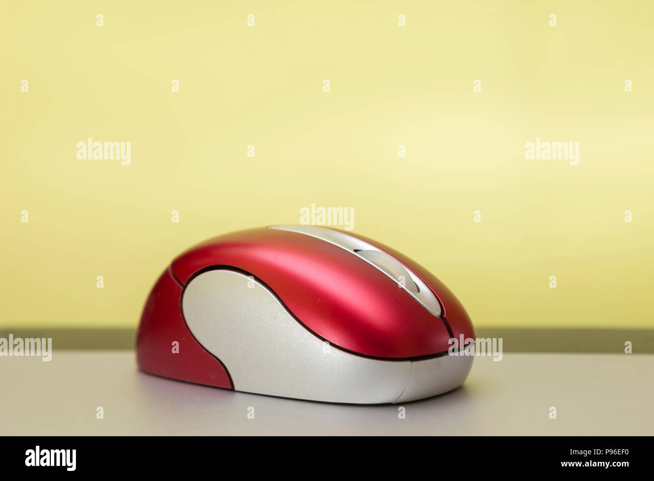 red and silver wireless mouse on a graphic tablet Stock Photo