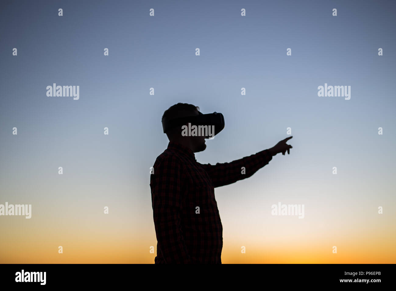 Future has come. Man wearing virtual reality goggles Stock Photo - Alamy