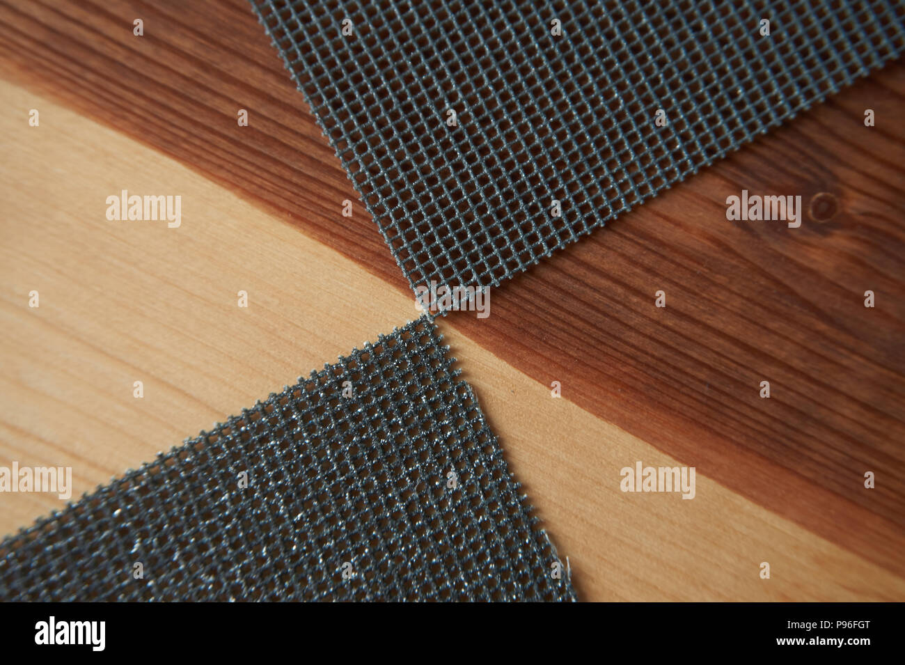 Sanding sheets on a wooden surface. Close-up abrasive equipment with copy space Stock Photo