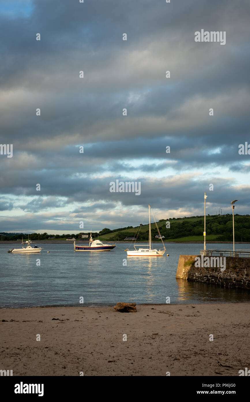 The Mall Beach Youghal and moored yachts in dramatic light in the River Blackwater in Youghal, County Cork, Ireland Stock Photo