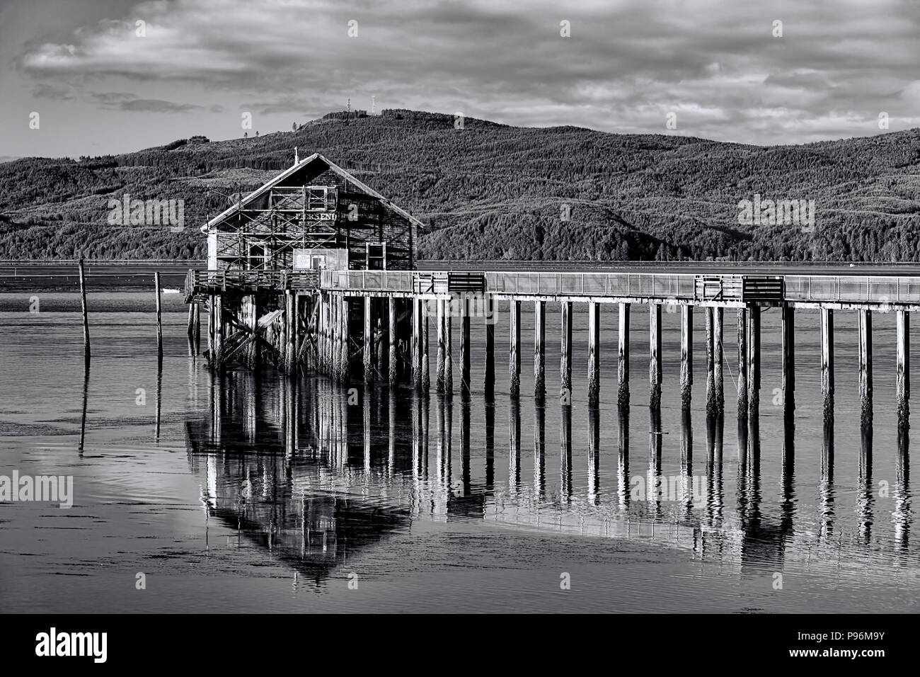 B&W of historic pier and shop on Tillamook Bay in Garibaldi, Oregon
