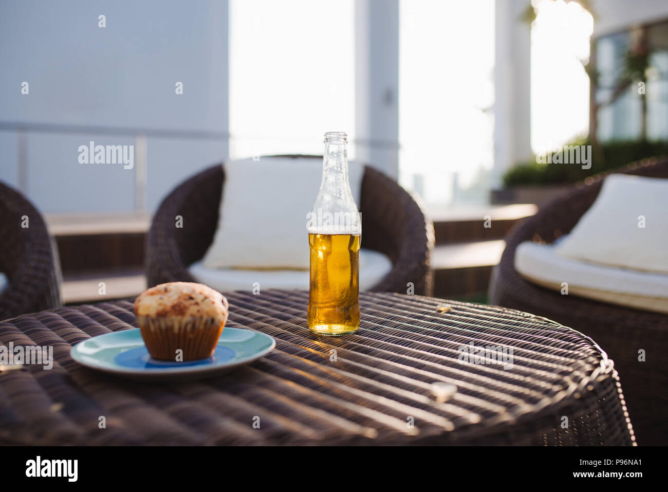 Blueberry cake with soft drinks on the garden table Stock Photo