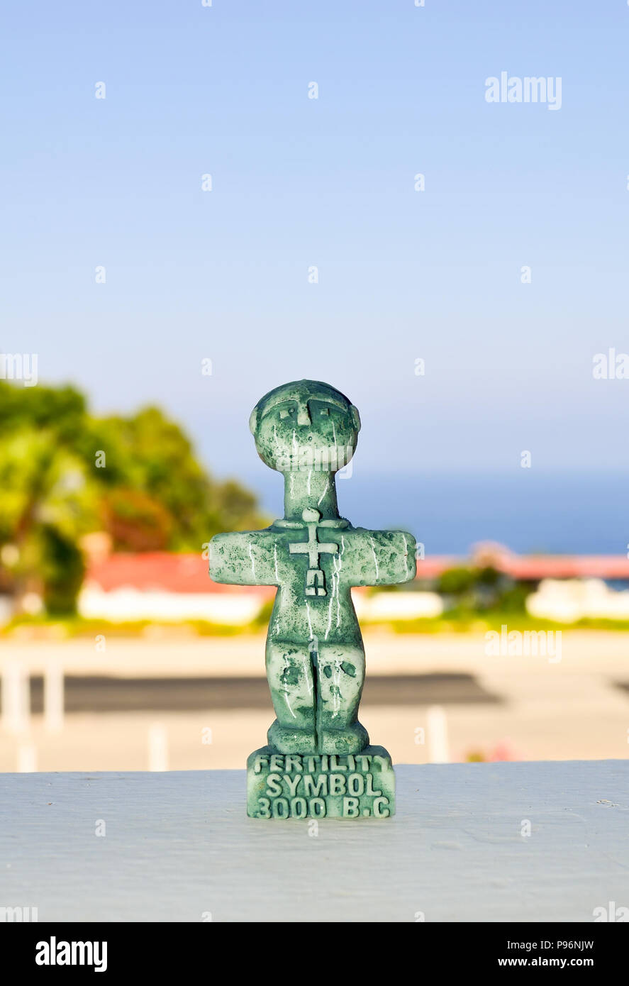Idol of Pomos, ancient symbol of fertility on Cyprus. A small sculpture on a blurred background. Traditional souvenir for tourists Stock Photo