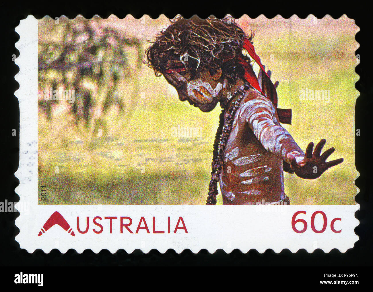 AUSTRALIA - CIRCA 2011:A Cancelled postage stamp from Australia shows Aboriginal Boy, issued in 2011. Stock Photo