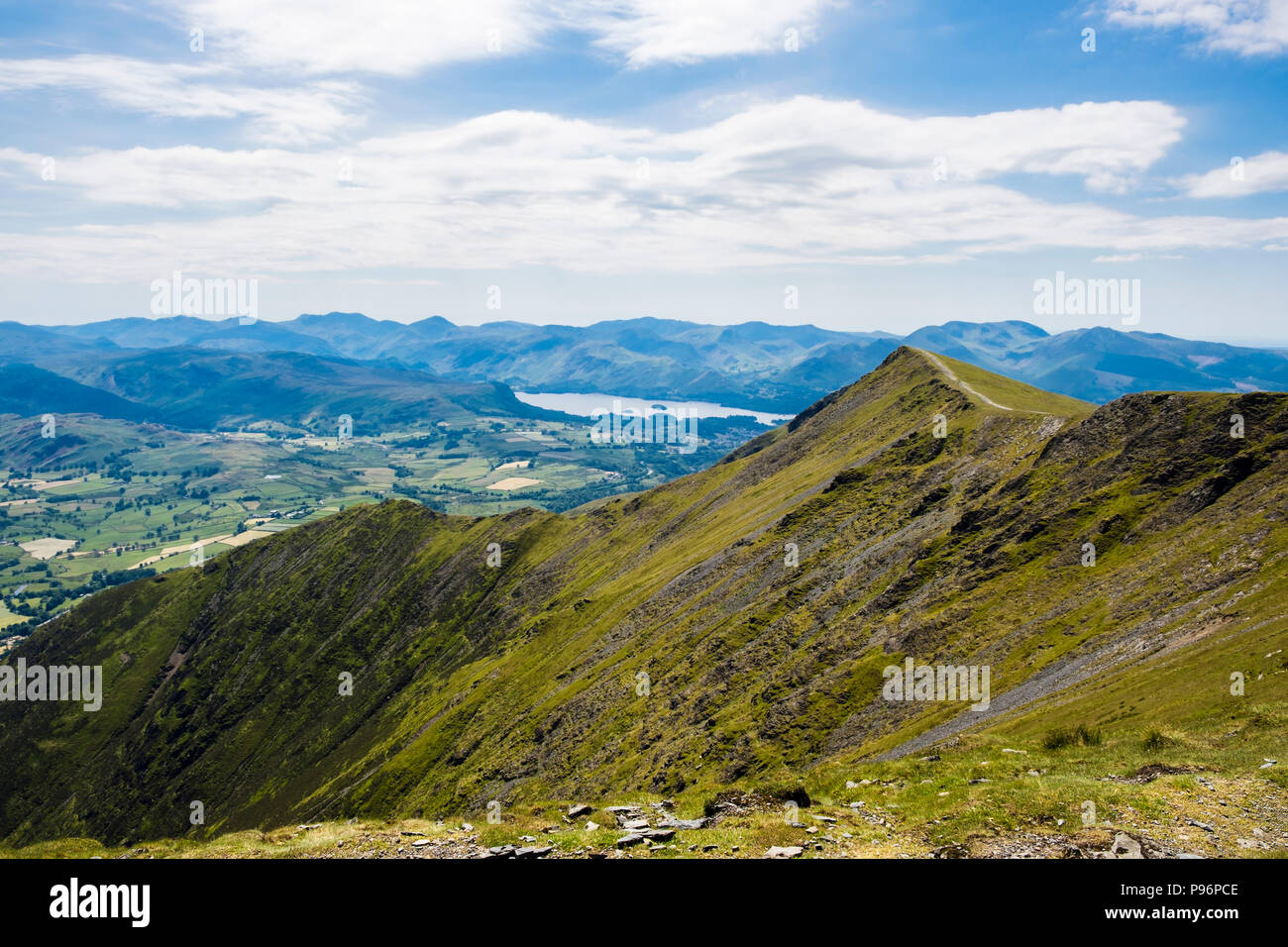 View along Blencathra (Saddleback) summit ridge to Derwentwater and mountains of Lake District National Park, Cumbria, England, UK, Britain Stock Photo