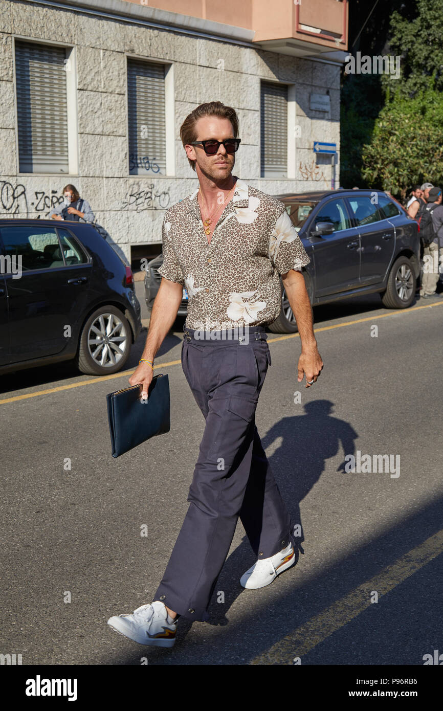 MILAN - JUNE 17: Man with beige floral shirt walking before Prada fashion  show, Milan Fashion Week street style on June 17, 2018 in Milan Stock Photo  - Alamy