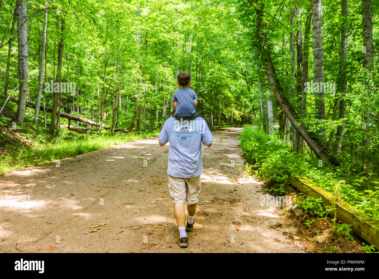 Grandfather and grandson walking together Stock Photo