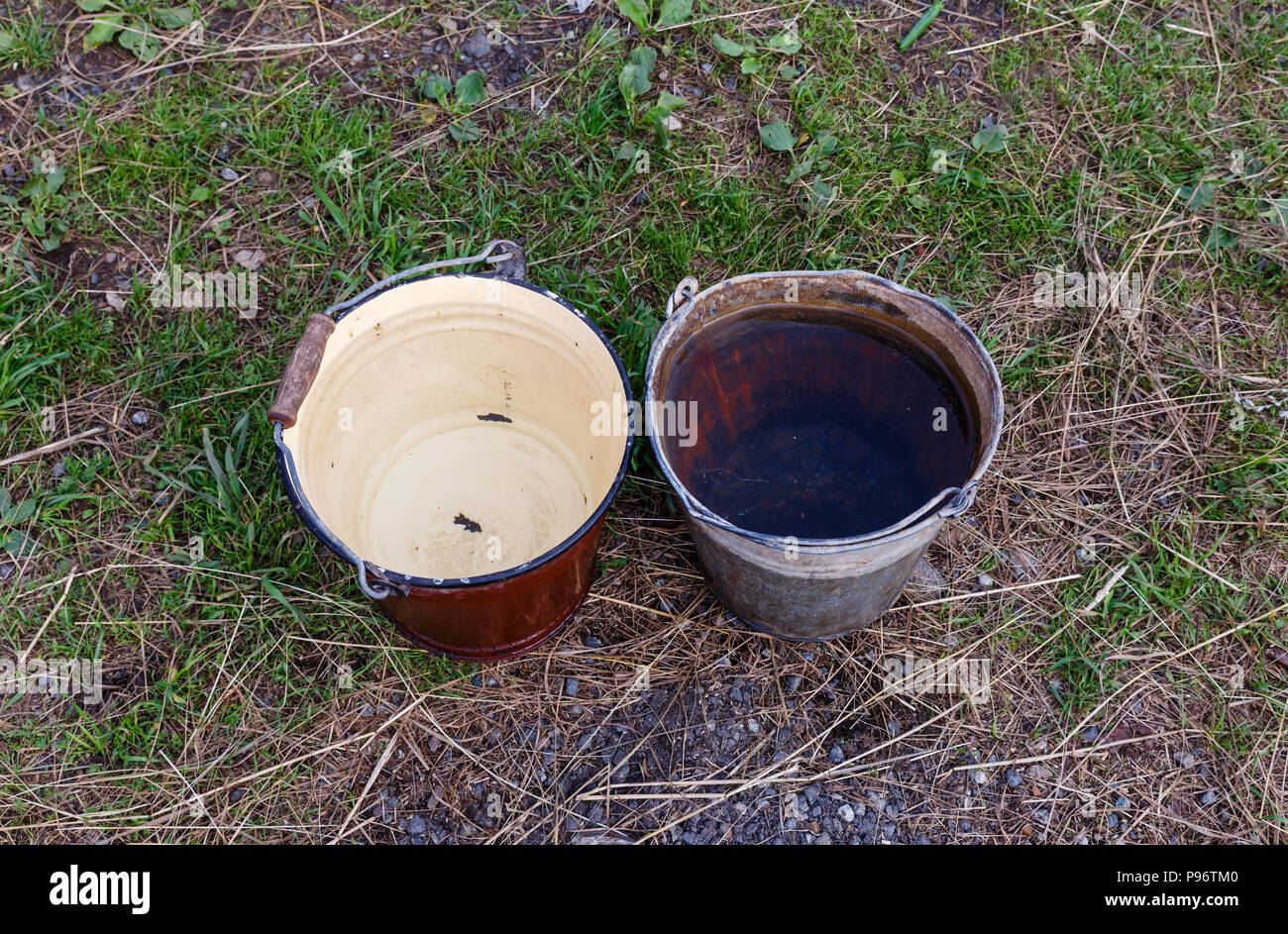 two iron buckets with clean water Stock Photo Alamy