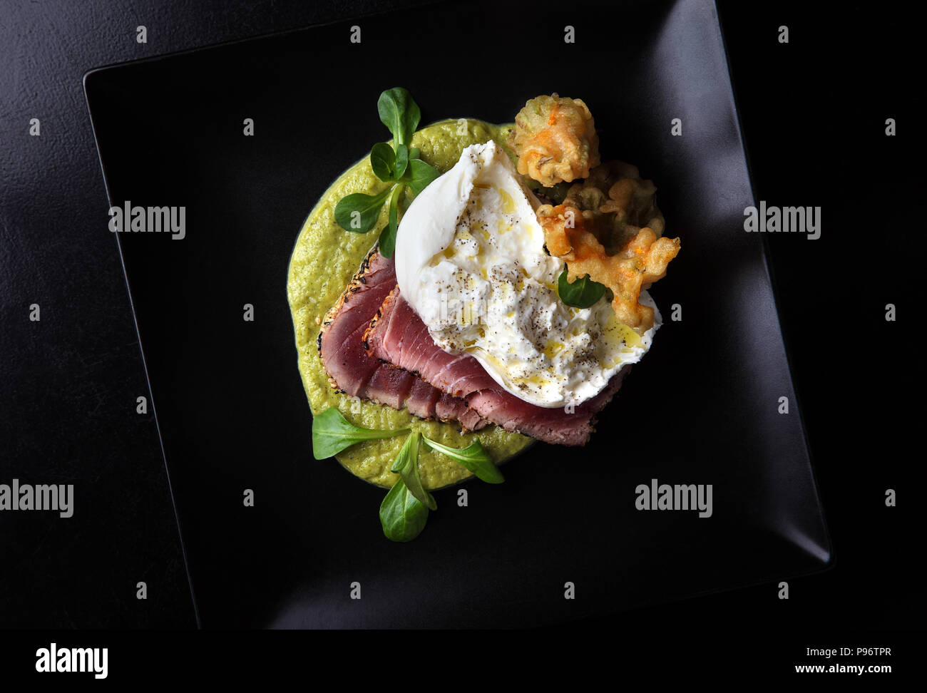 Tuna Steak with burrata mozzarella cheese,courgette flowers, laid on