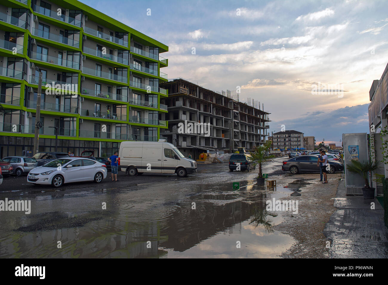 13 July 2018-Mamaia, Romania. The buidlings and terraces after a storm at the sea side with streets flooded at sunset. Stock Photo