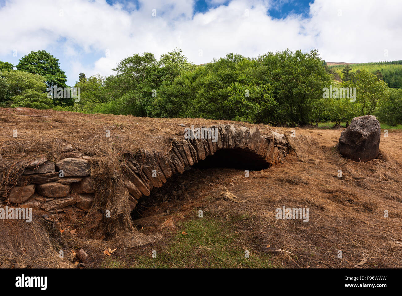 Ancient bridge only visible during drought, Injebreck reservoir, West Baldwin, Isle of Man. Stock Photo