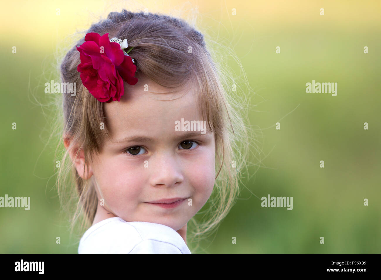 Portrait Of Beautiful Small Preschool Blond Girl With Nice Gray