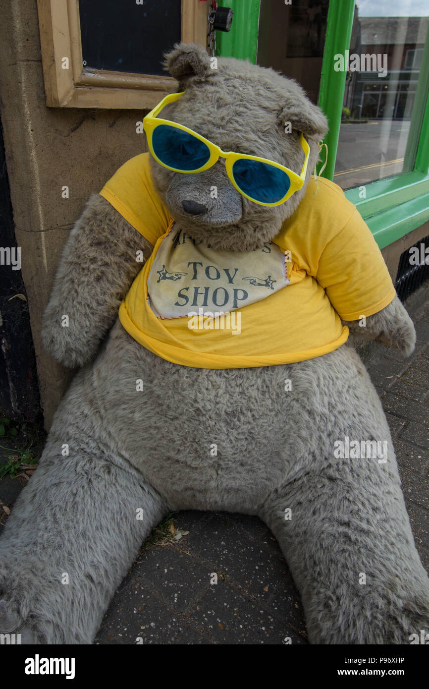 Teddy bear with sun glasses in Olney village Bedfordshire UK Stock