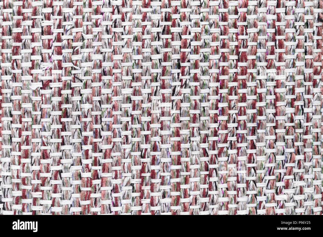 Red hand weaving matting tweed fabric texture. Closeup horizontal fragment Stock Photo