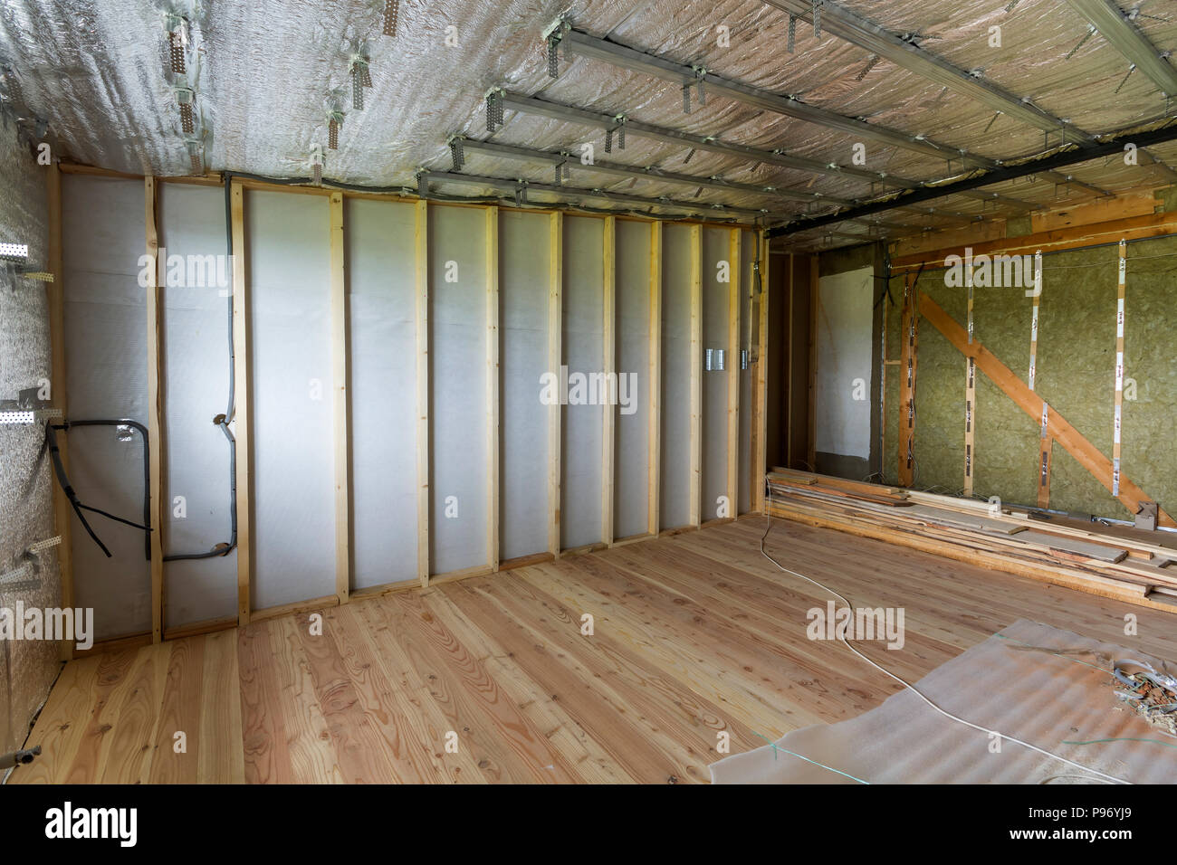 Room Under Construction And Renovation With Silver Aluminum Foil