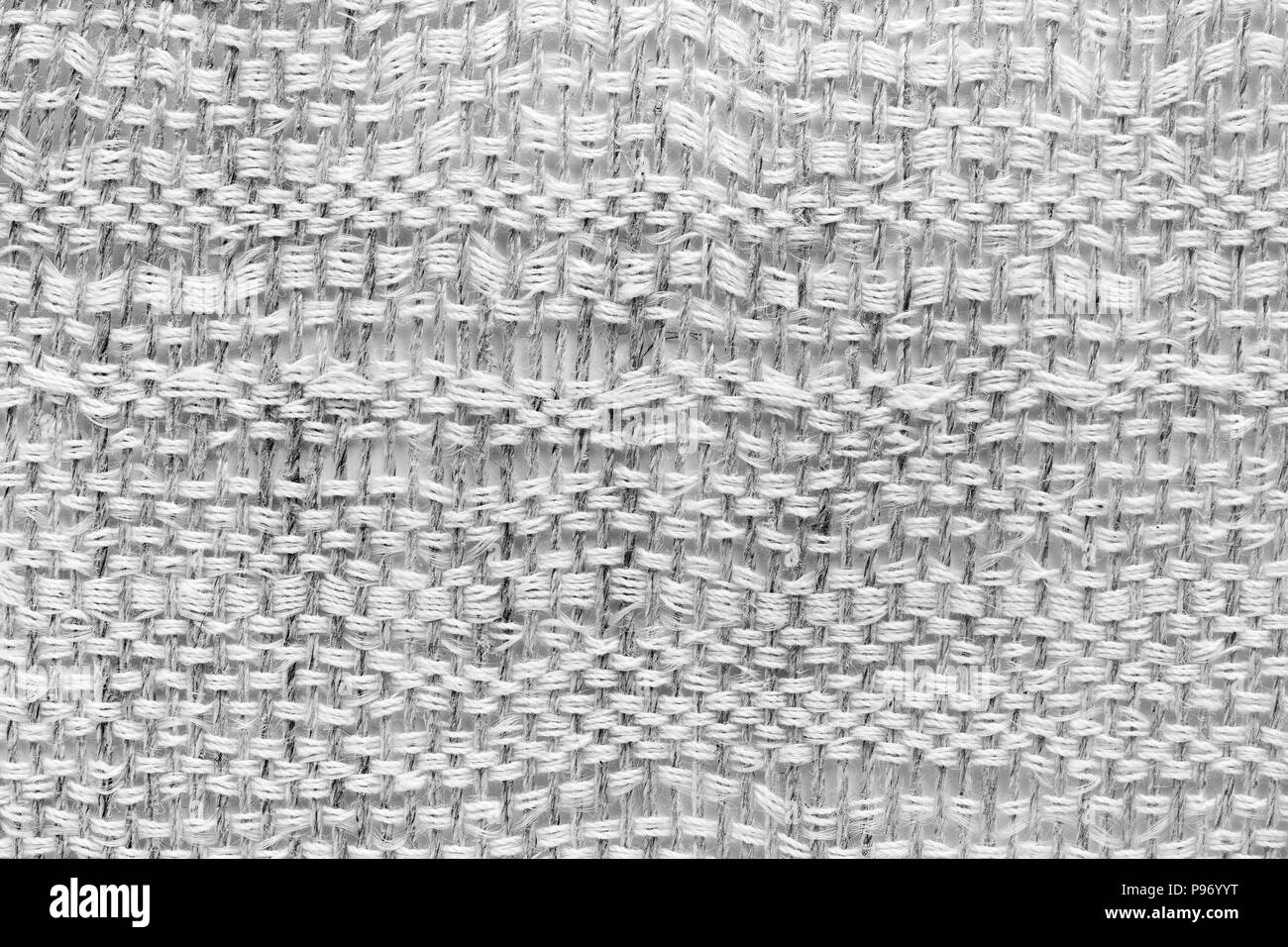 White hand weaving matting tweed fabric texture. Closeup horizontal fragment Stock Photo