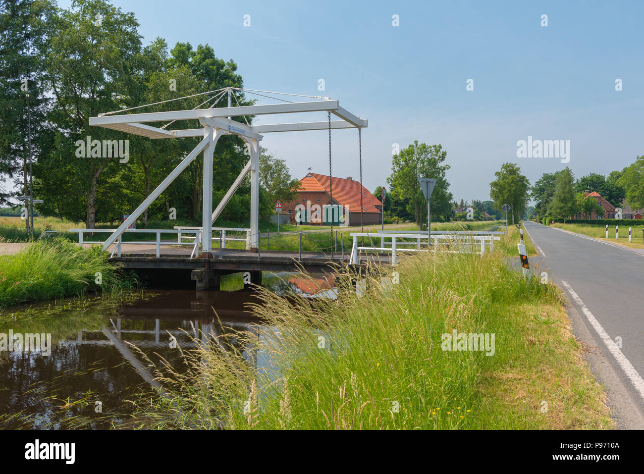 'Swajwieksklapp Bridge', Klappbrücke, drawbridge, Spetzerfehn,Fehnort, canal, Fehnkanal,  East Frisia, Lower Saxony, Germany, Europe Stock Photo