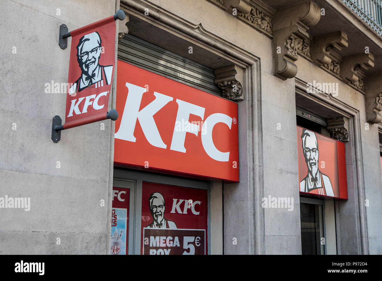 KFC sign on Passeig de Gràcia street in Barcelona. Barcelona is a city in Spain. It is the capital and largest city of Catalonia, as well as the second most populous municipality of Spain. In 2009 the city was ranked Europe's third and one of the world's most successful as a city brand. In the same year the city was ranked Europe's fourth best city for business and fastest improving European city, with growth improved by 17% per year, and the city has been experiencing strong and renewed growth for the past three years. Stock Photo