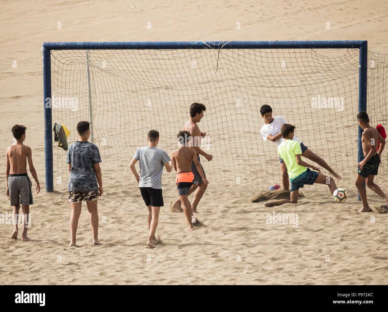 Children playing football on beach in Spain Stock Photo Alamy