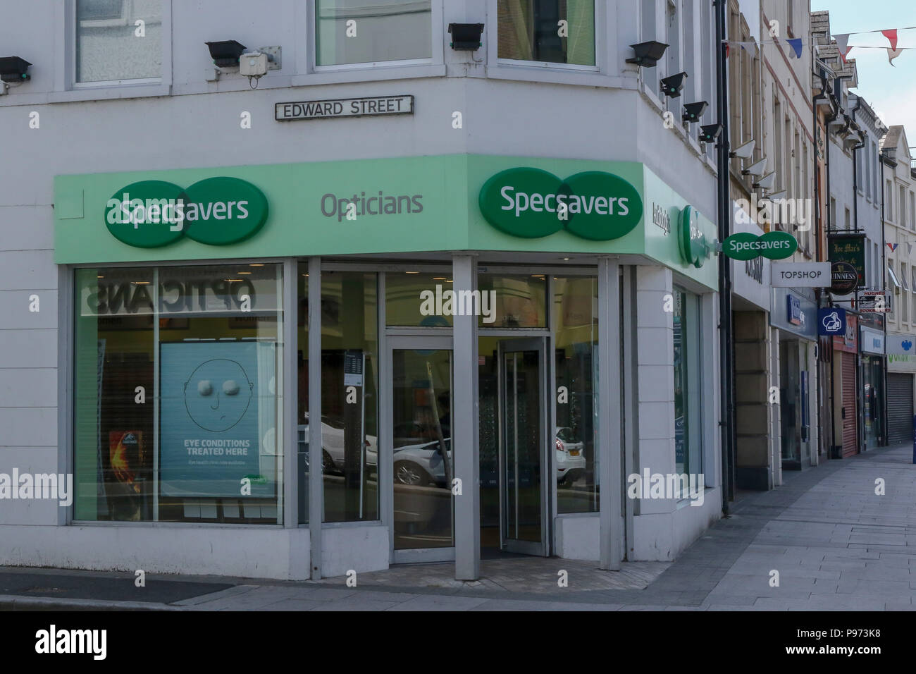 Specsavers opticians shop on the corner of a town centre main street. Stock Photo