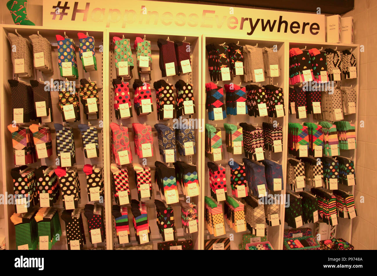 Colourful footwear on display and for sale in a shop here in London, England Stock Photo