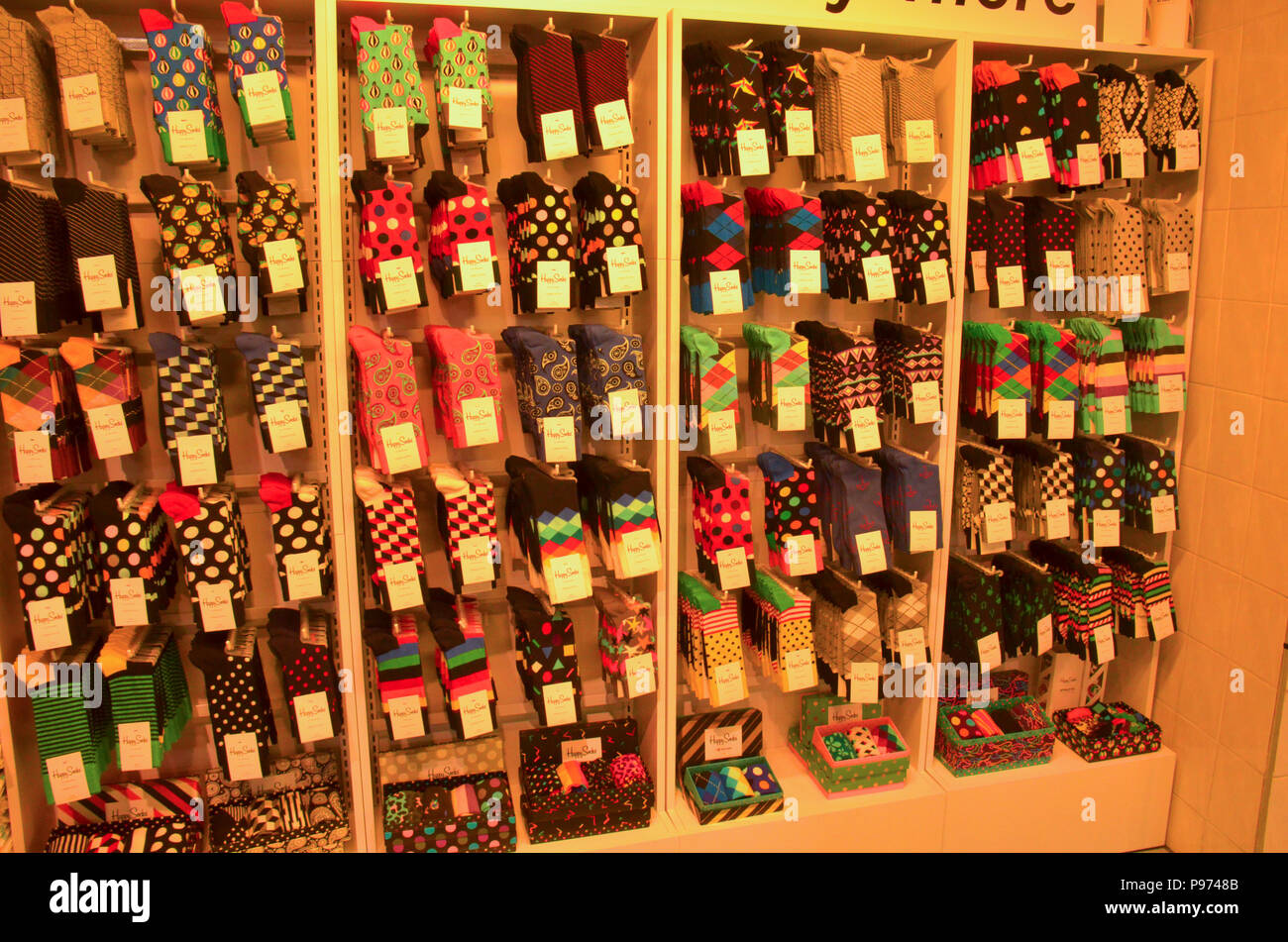 Colourful footwear on display and for sale in a shop here in London, England Stock Photo