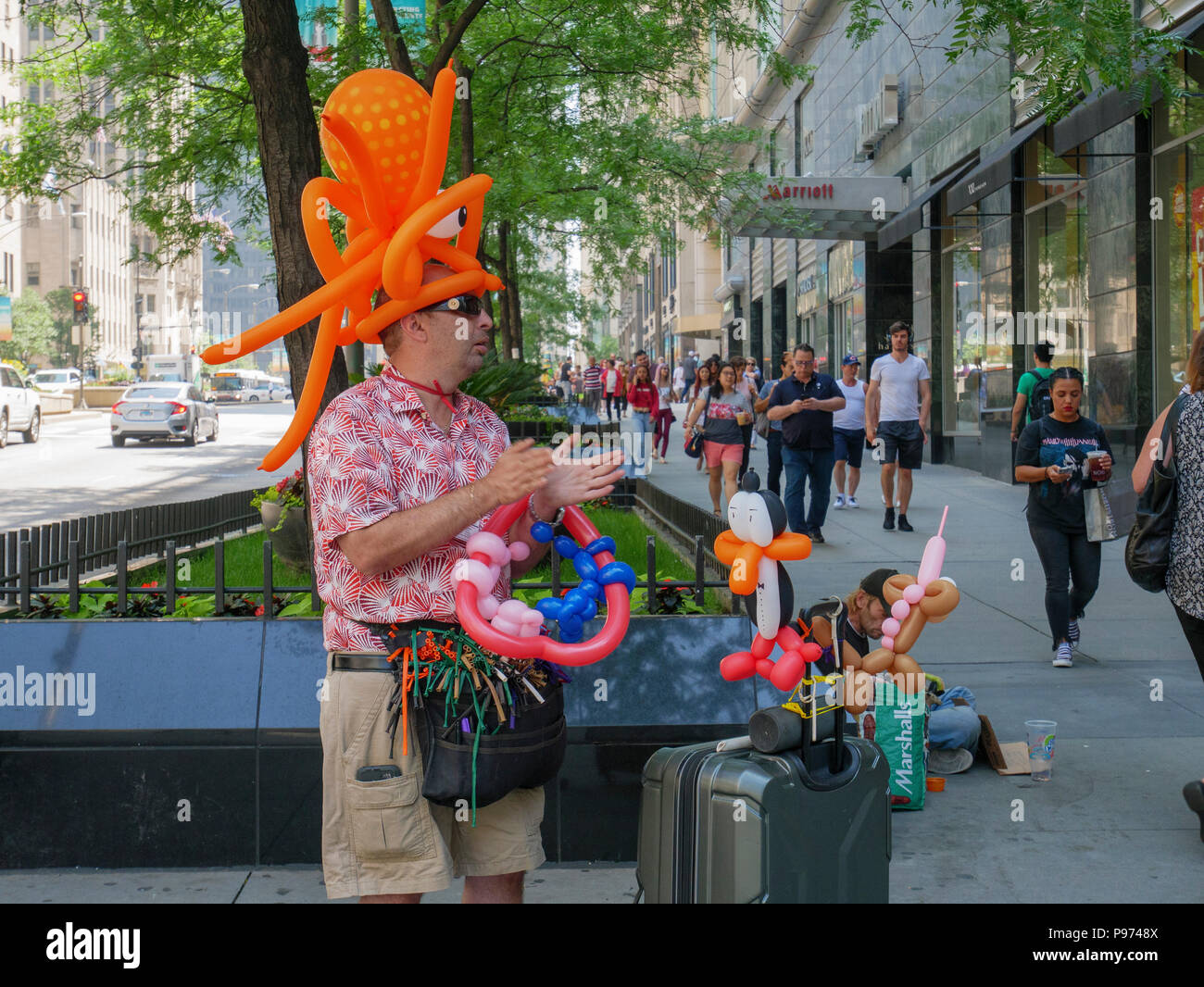 Street vendor selling balloon animals. Michigan Avenue, Chicago