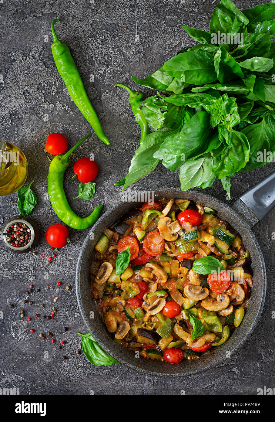 Hot spicy stew eggplant, sweet pepper, tomato, zucchini and mushrooms