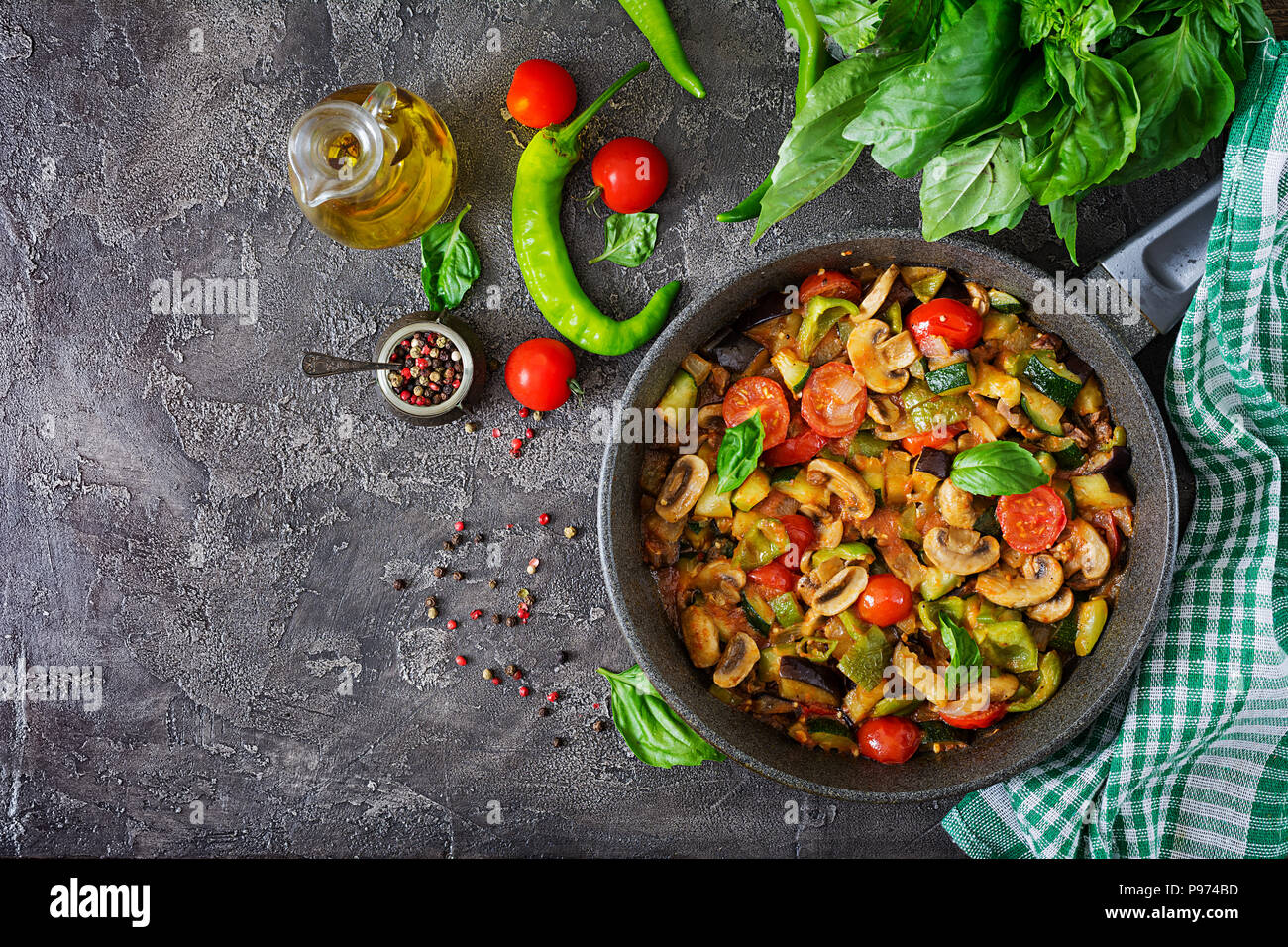 Hot spicy stew eggplant, sweet pepper, tomato, zucchini and mushrooms