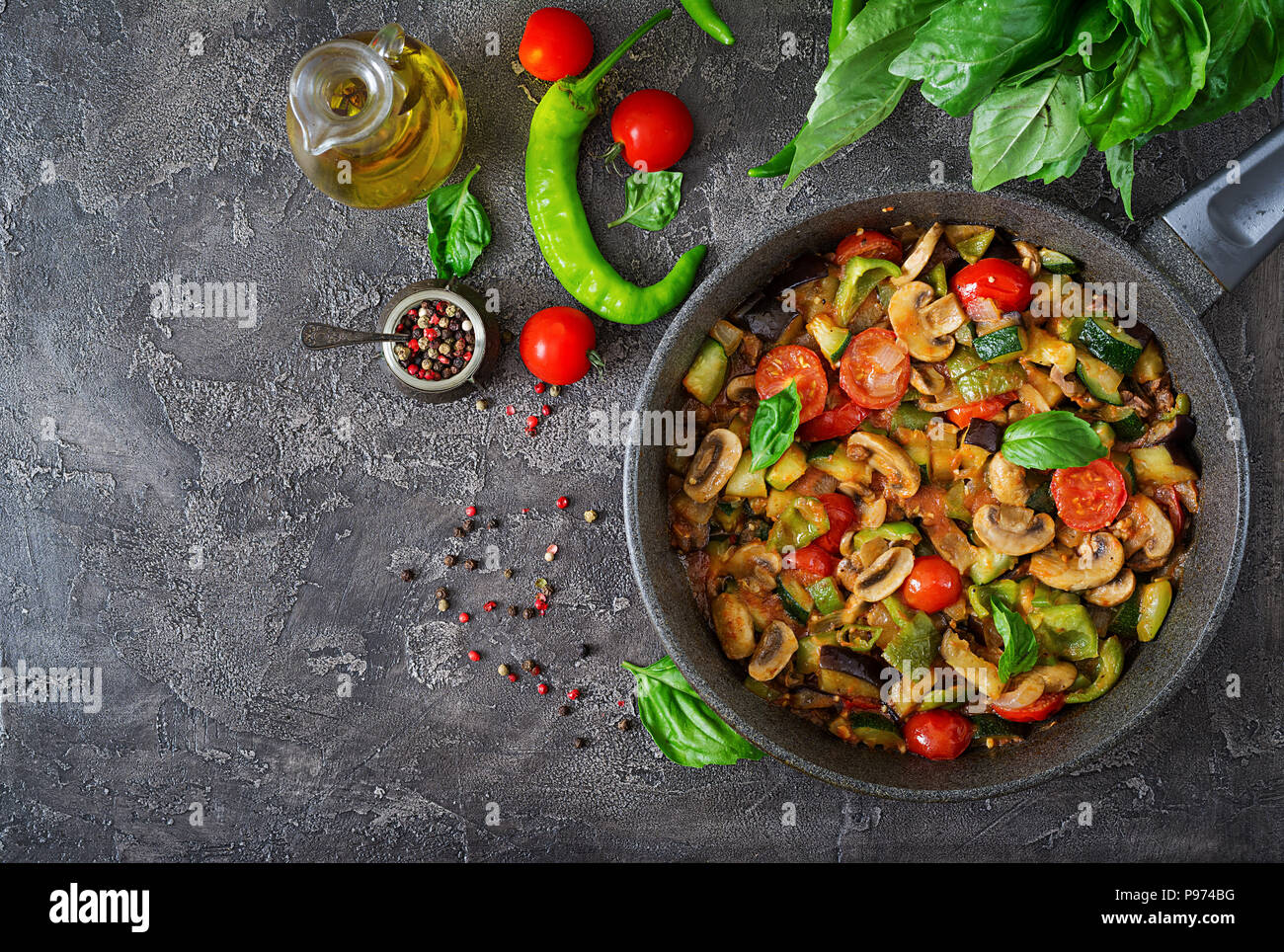 Hot spicy stew eggplant, sweet pepper, tomato, zucchini and mushrooms